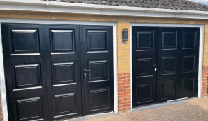 novoferm georgian side hinged doors in black with white steel frames, the doors have a 1 3 2 3 split, and were finished off with upvc trims