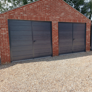 pair of cartech insulated side hinged doors in anthracite wood grain with a centre ribbed design